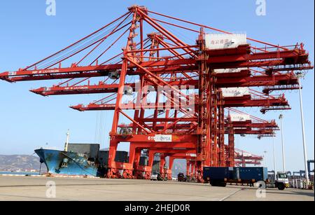 LIANYUNGANG, CHINA - JANUARY 11, 2022 - A view of cargo loading and unloading at the Port of Lianyungang, Lianyungang City, Jiangsu Province, China, J Stock Photo