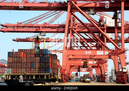 LIANYUNGANG, CHINA - JANUARY 11, 2022 - A view of cargo loading and unloading at the Port of Lianyungang, Lianyungang City, Jiangsu Province, China, J Stock Photo