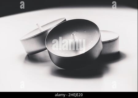 Monochrome white three tea light close up Stock Photo
