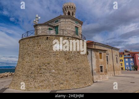 Punta lighthouse and Our Lady of Health Church in Piran town, Slovenia Stock Photo