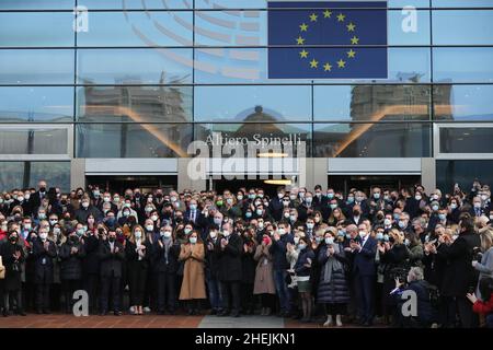 (220111) -- BRUSSELS, Jan. 11, 2022 (Xinhua) -- People react after observing a moment of silence in memory of late European Parliament President David Sassoli, in front of the European Parliament in Brussels, Belgium, Jan. 11, 2022. European Parliament President David Sassoli died at age 65 at a hospital in Italy early Tuesday, his spokesperson has said.Sassoli, born on May 30, 1956, in Florence, Italy, had been hospitalized for more than two weeks due to a serious complication relating to immune system dysfunction. Sassoli was elected to the European Parliament in 2009. He became president of Stock Photo