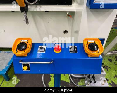 Start button on control box press machine Stock Photo