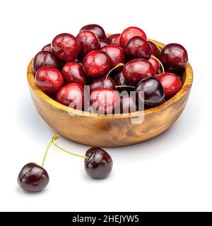 Fresh sweet cherries in wooden bowl isolated on white background. Cherry on white background. Stock Photo