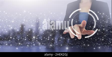 Innovation, big data concept technology. Hand touch digital screen hologram circular diagram sign on city light blurred background Stock Photo