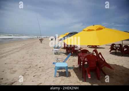 conde, bahia, brazil - january 8, 2022: umbrella and chair on the beach of Sitio do Conde on the North Coast of Bahia Stock Photo