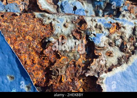 Close up shot of a very rusty blue painted iron surface. Stock Photo