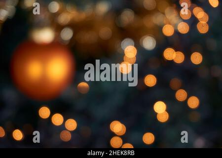 Blurred Christmas lights in tree. Abstract bokeh holiday background. Stock Photo
