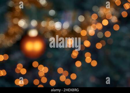 Blurred Christmas lights in tree. Abstract bokeh holiday background. Stock Photo