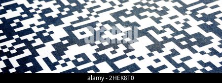 Close-up of QR code printed on paper. Abstract QR background banner. Stock Photo
