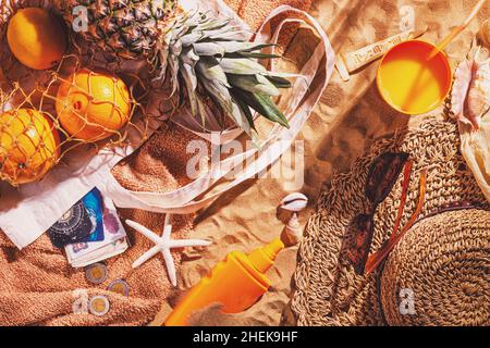 Concept of sandy beach holiday, top view. Sand background with copy space for text, flat lay. Egypt vacation concept with souvenirs and accessories Stock Photo