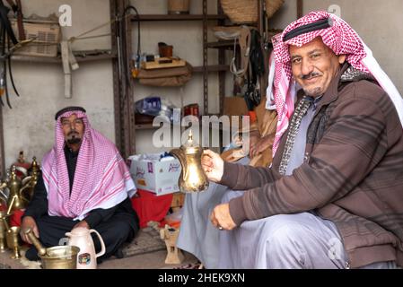 Ushaiqer, Saudi Arabia, 1st January 2022: Saudi man at a market shop, resting Stock Photo