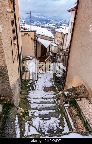 Steps, alleys and snow-white roofs in the small mountain town of Secinaro. Secinaro, province of L'Aquila, Abruzzo, Italy, europe Stock Photo