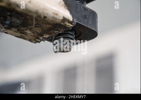 Dirty thread of the car lift machine with grease in garage workshop Stock Photo