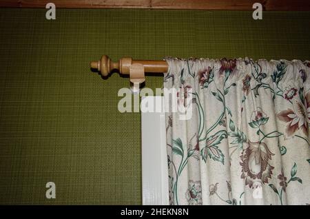 Symbolic image: Concept of shabby curtains in front of a window using the example of an unkempt Swedish holiday home. Stock Photo