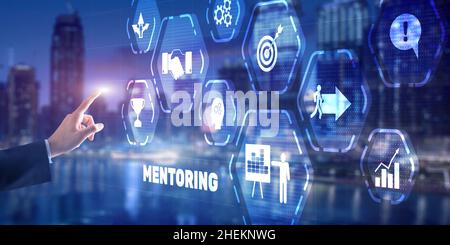 Businessman pressing inscription Mentoring. Training Personal development education coaching concept. Stock Photo