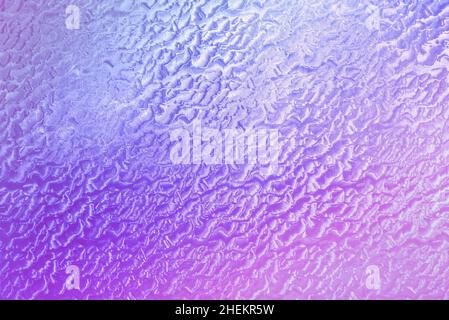 Abstract background. Embossed self-adhesive film. Pink-purple tinted, colors of 2022, Very Peri. Stock Photo
