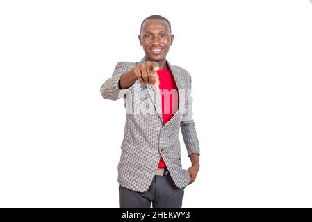 portrait of an adult businessman pointing his finger at you and smiling at the camera. Stock Photo