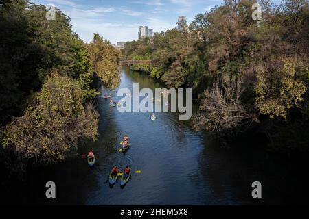 Austin Texas USA, October 17 2021: View from Barton Springs Road of kayakers and stand-up paddleboarders enjoying beautiful fall weather,  looking north at the mouth of Barton Creek. ©Bob Daemmrich Stock Photo