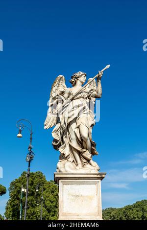 Bernini's marble statue of angel with cross from the Sant'Angelo Bridge in Rome, Italy Stock Photo