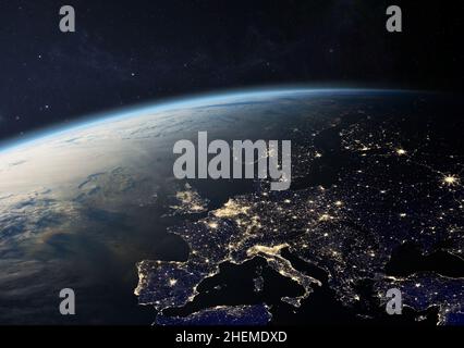 Planet Earth from the space at night. Europe with city lights in UK, Germany, France and other countries. Elements of this image furnished by NASA. Stock Photo