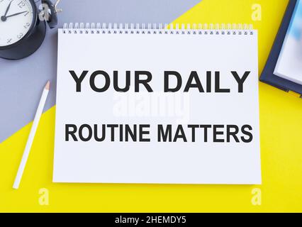 Your Daily Routine Matters. Handwriting Iin Notebook, Business concept, Top view flat lay. Stock Photo