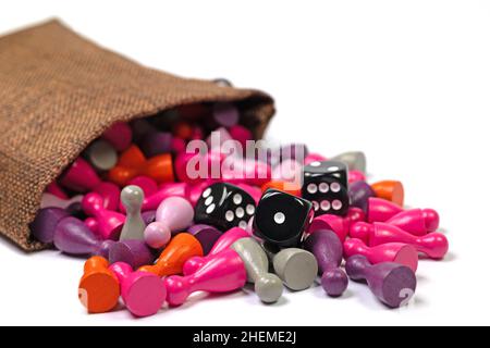 Lots of colorful wooden cones and cubes in a jute bag Stock Photo