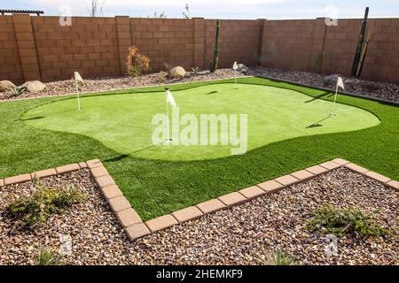 Rear Yard With Four Hole Putting Green Stock Photo