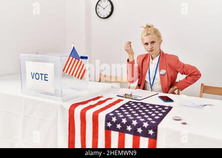 Beautiful caucasian woman working at political campaign doing italian gesture with hand and fingers confident expression Stock Photo