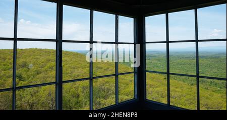 View from fire tower on Stissing Mountain, Pine Plains, NY. The tower, built in the 1930's is 90 feet tall. Stock Photo