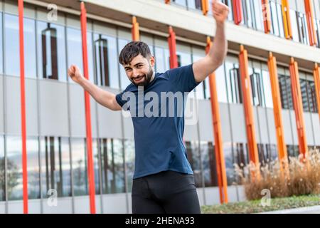 Young man doing their stretches Stock Photo