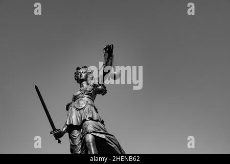 lady justice with sword and scale symbolizes justice Stock Photo
