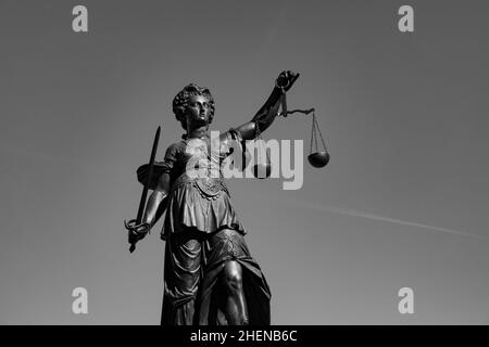 lady justice with sword and scale symbolizes justice Stock Photo