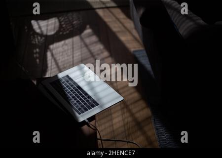 Laptop on the table in the interior of the apartment Stock Photo