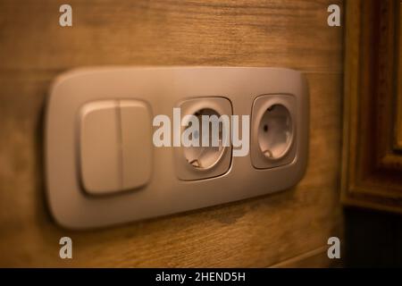 Socket for electrical appliances in a modern apartment inside the house Stock Photo