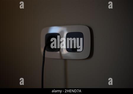 Socket for electrical appliances in a modern apartment inside the house Stock Photo