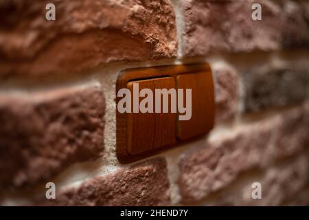 Switch for light on the wall inside the house Stock Photo