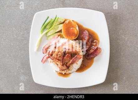 Barbecued red pork in sauce with rice Stock Photo