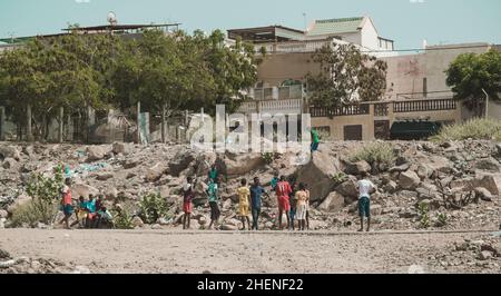 Djibouti, Djibouti - May 21, 2021: Djiboutian children playing football on the field in Djibouti. Editorial shot in Djibouti.. Stock Photo