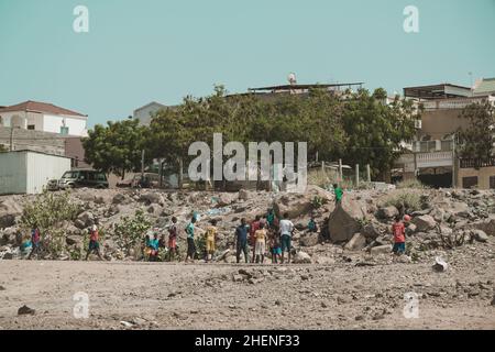 Djibouti, Djibouti - May 21, 2021: Djiboutian children playing football on the field in Djibouti. Editorial shot in Djibouti.. Stock Photo