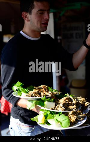 Deep fried Sardines served at a Turkish seafood restaruant by the Golden Horn in Istanbul, Turkey. Stock Photo