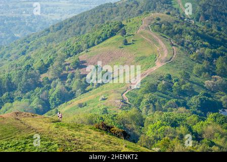 Malvern Worcestershire,England-June 01 2021:Visitors to this popular beauty spot,enjoy exercising and taking in the beautiful views from the various h Stock Photo