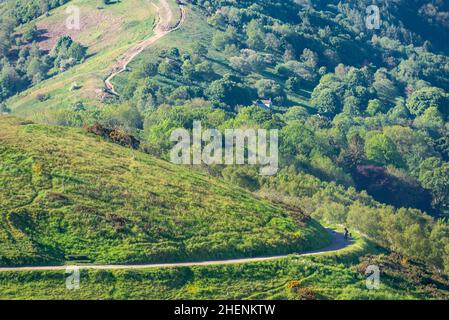 Malvern Worcestershire,England-June 01 2021:Visitors to this popular beauty spot,enjoy exercising and taking in the beautiful views from the various h Stock Photo