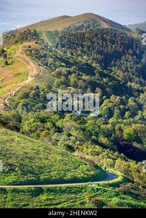 Malvern Worcestershire,England-June 01 2021:Visitors to this popular beauty spot,enjoy exercising and taking in the beautiful views from the various h Stock Photo