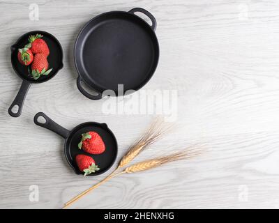 Plastic Plate with Special Design Cast Iron Look a Like with Fresh Strwaberry Stock Photo