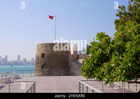 Bu Maher Fort, Muharraq, the start of Bahrain’s Pearling Trail, Manama in the distance, Kingdom of Bahrain Stock Photo