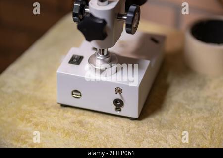 Stereo Microscope for repairing cell phone Mobile Phone Repair with Top and Bottom LED Light. Stock Photo