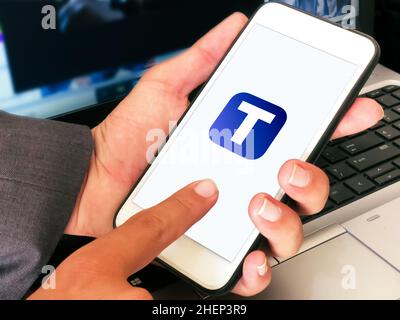 Man Using Truth Social Application on Mobile Background. Editorial Social Media new app concept Stock Photo