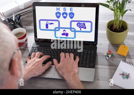 Hse concept shown on a laptop used by a man Stock Photo