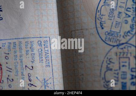 UAE and Oman stamps in the passport. Stock Photo