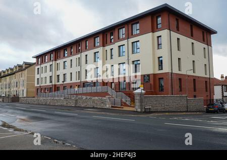 Rhyl, UK. Dec 25, 2021. The Grange is a block of apartments for people over 55 beside the promenade of Rhyl. The building was constructed by Anwyl Par Stock Photo